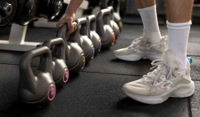 close-up-hand-holding-kettlebell_23-2149307701