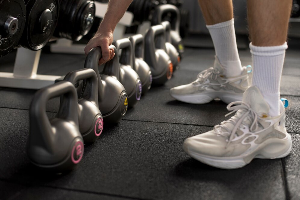 close-up-hand-holding-kettlebell_23-2149307701