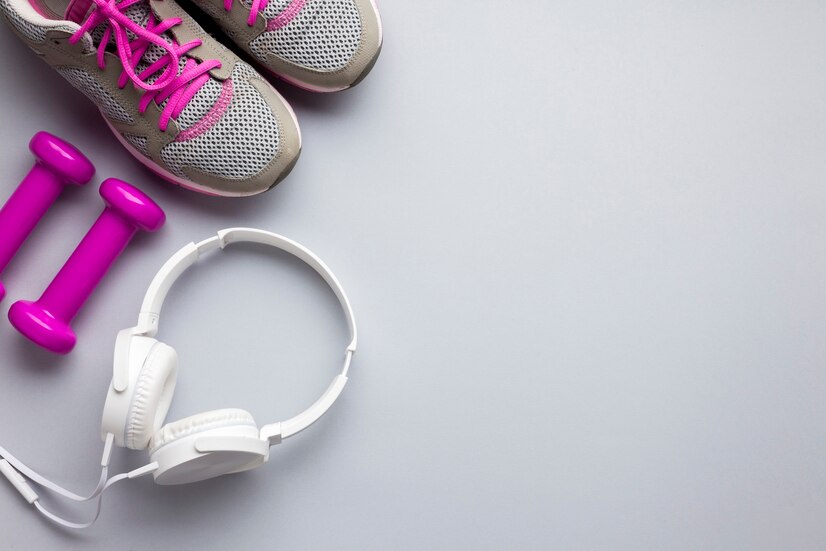 top-view-pink-sports-attributes-with-headphones_23-2148259096